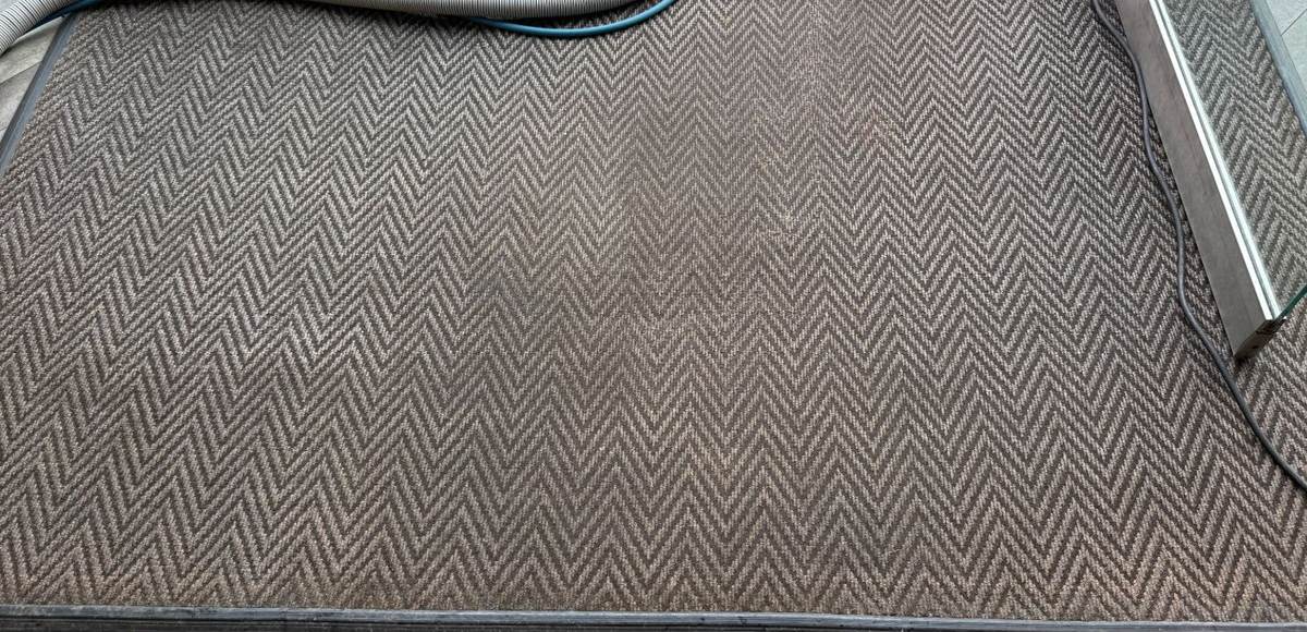 Entrance matting at a Borehamwood coffee shop after cleaning by Jay's Cleaning, the herringbone pattern sharp again