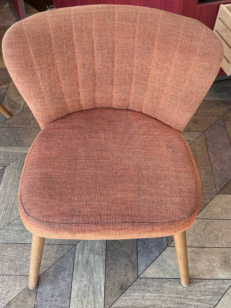 The same coffee shop chair after cleaning by Jay's Cleaning, the seat pad an even colour again