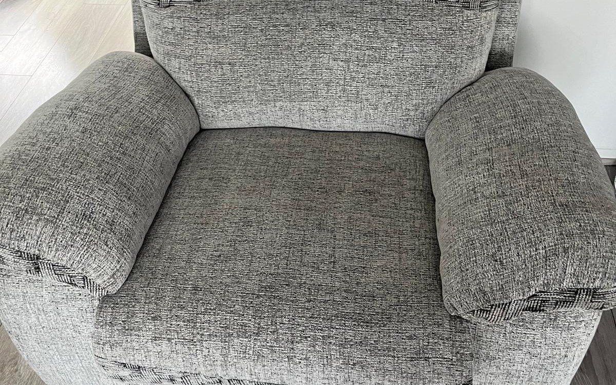 A comfy living-room armchair after deep cleaning by Jay's Cleaning
