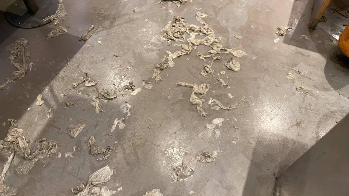 Stripping the old polish off a restaurant floor on Baker Street, central London