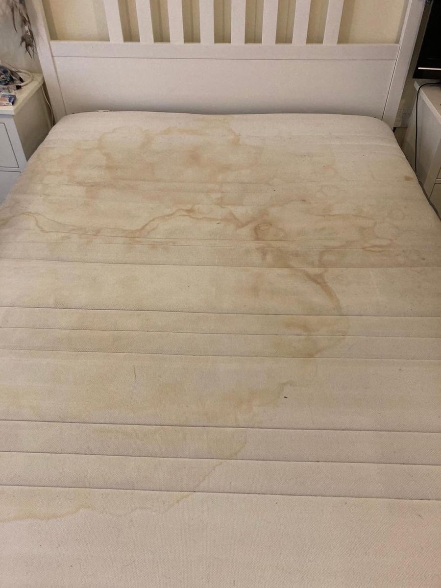A stained mattress before cleaning