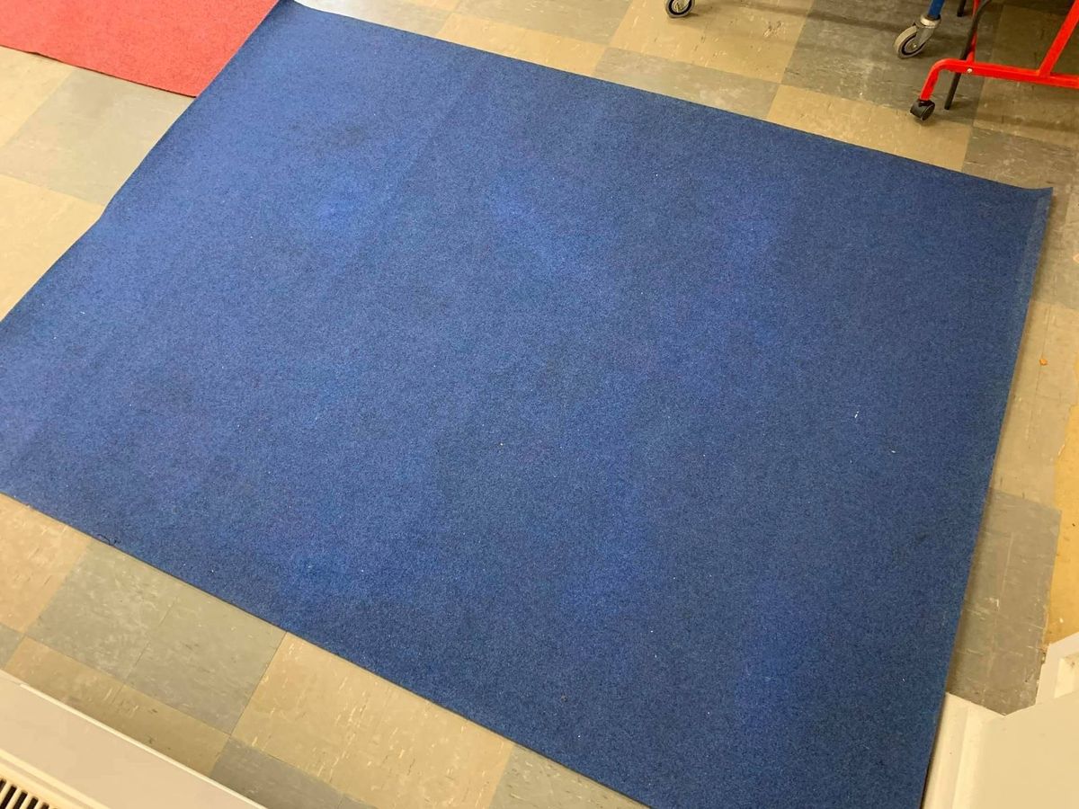 The same blue rug after cleaning by Jay's Cleaning