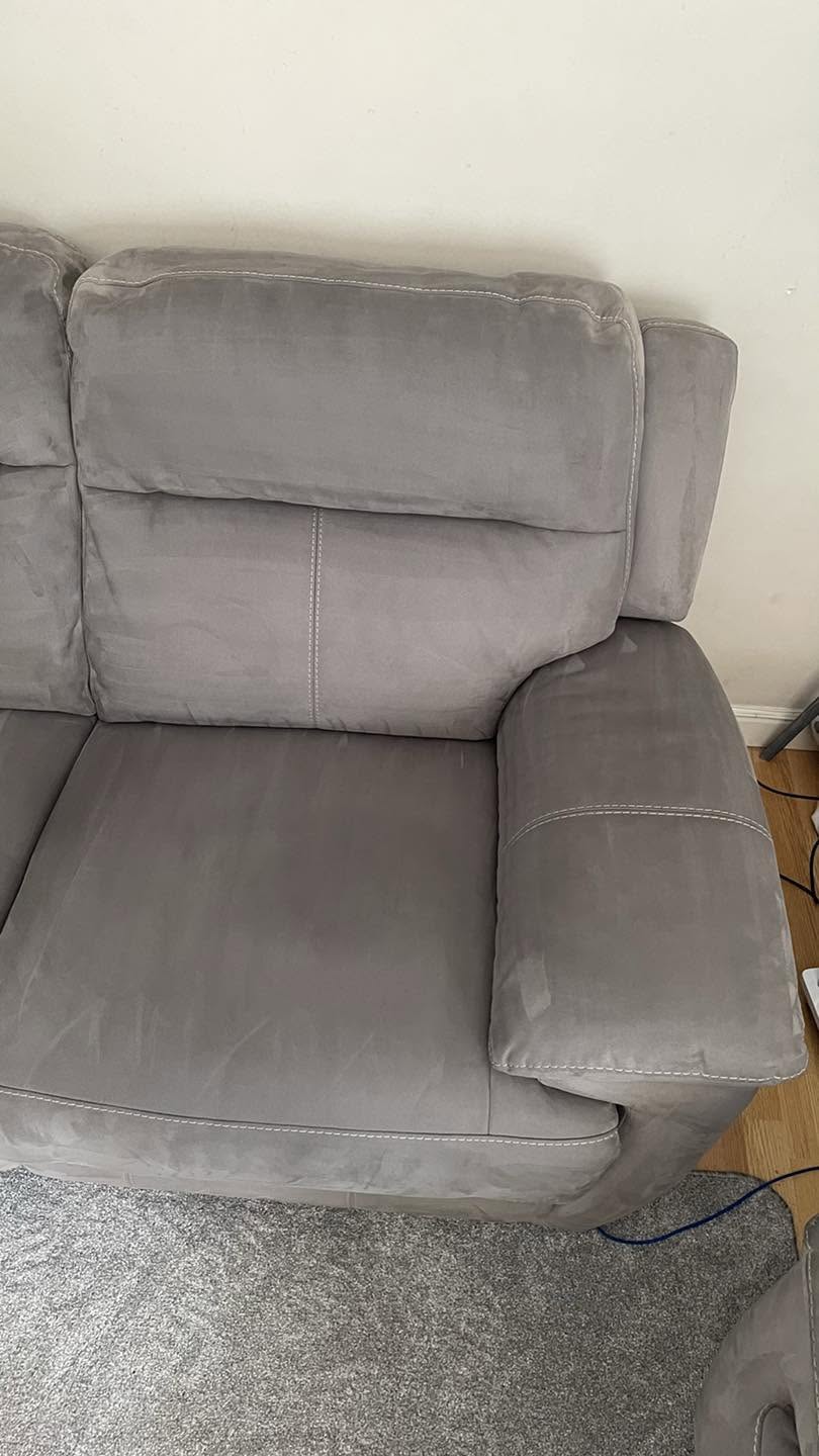 The same grey sofa after deep cleaning