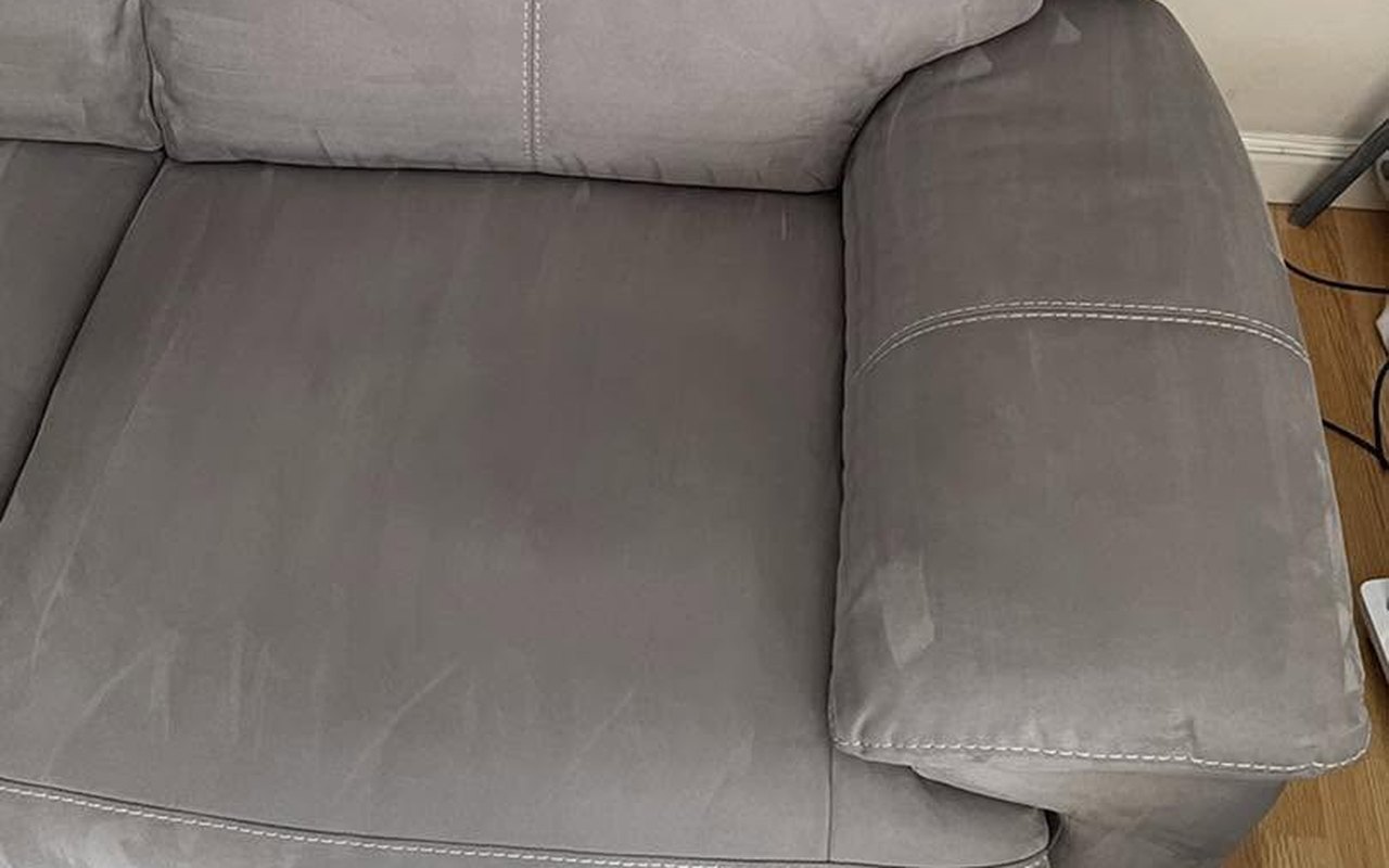 The same grey sofa after cleaning &mdash; rings and grime gone