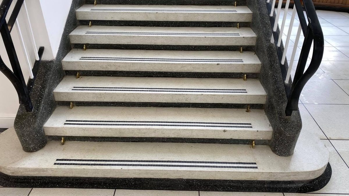 The restored terrazzo staircase, treads bright white again