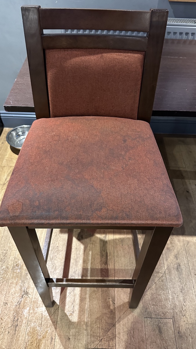 The same chair before cleaning — soiled and worn