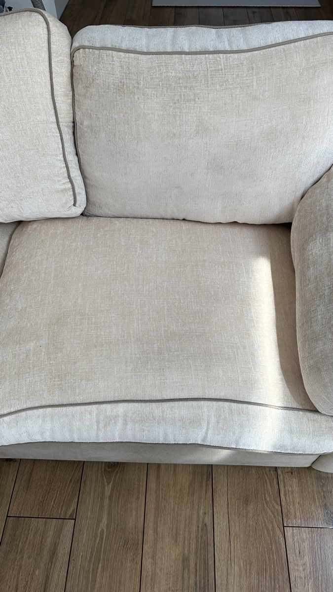 A cream fabric sofa freshly cleaned