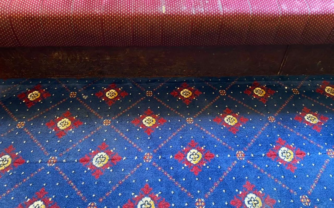The same function-room carpet after cleaning &mdash; stain gone and colours revived