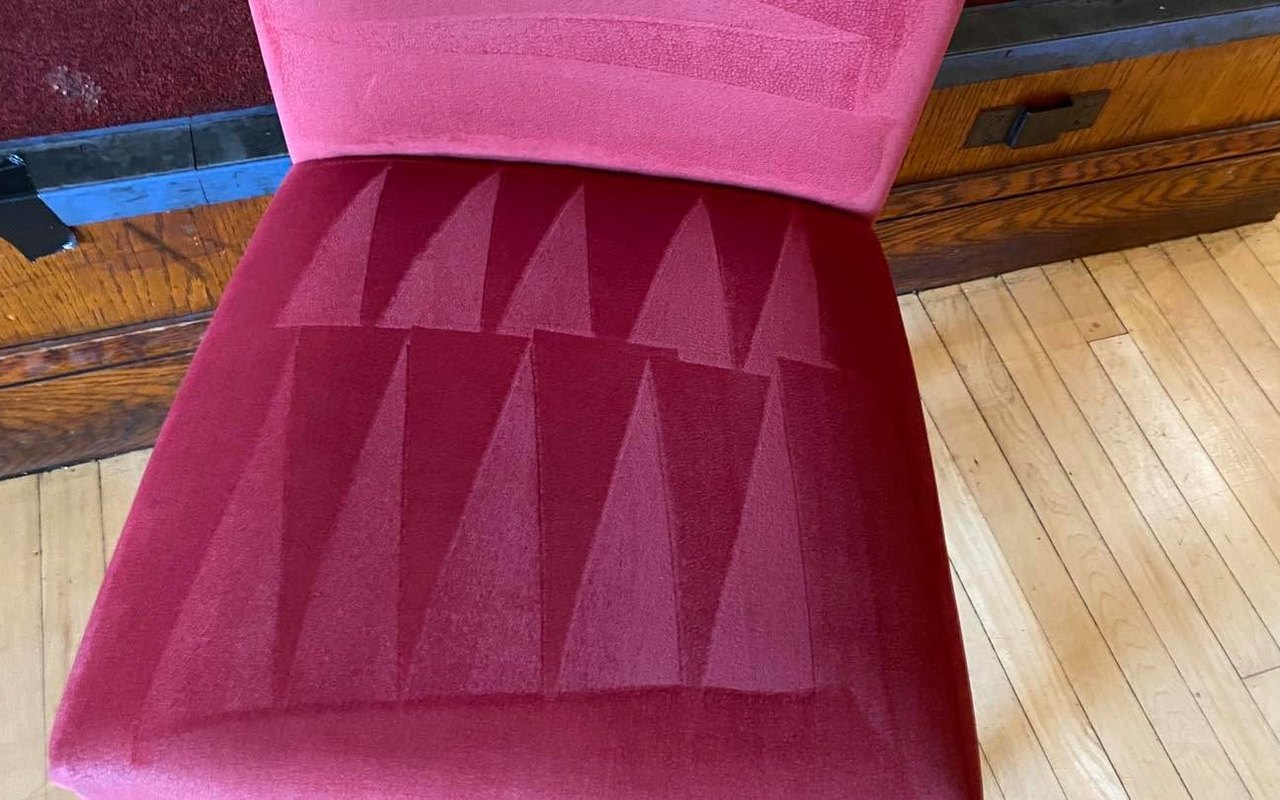 The same velvet chair after cleaning &mdash; stains gone and pile groomed