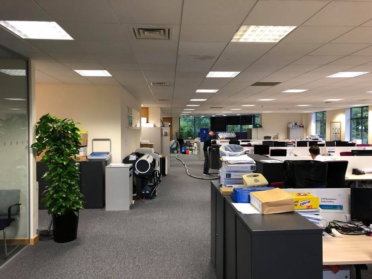 Extraction-cleaning the carpets of an open-plan office