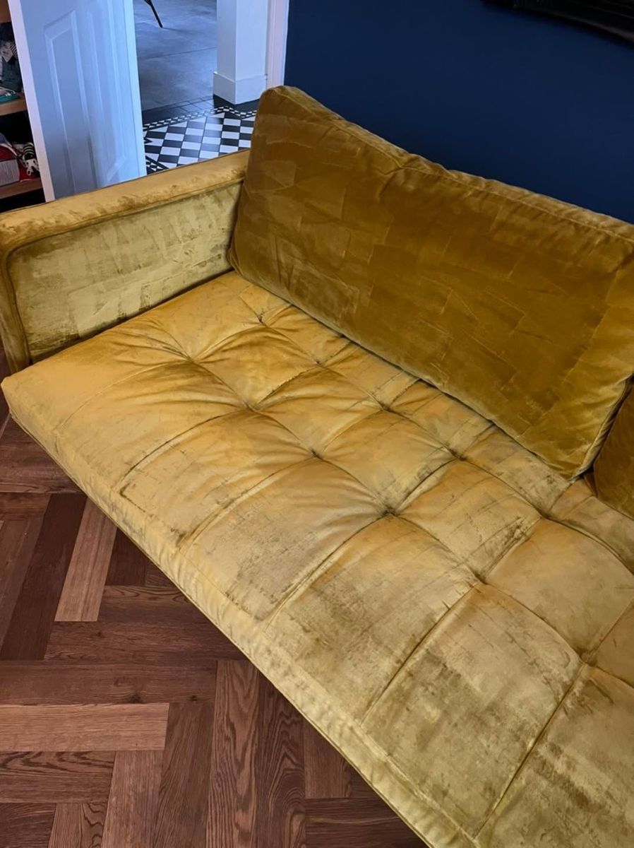 The sofa after the red wine stain was removed